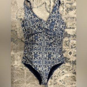 Nip tuck one piece swimsuit.